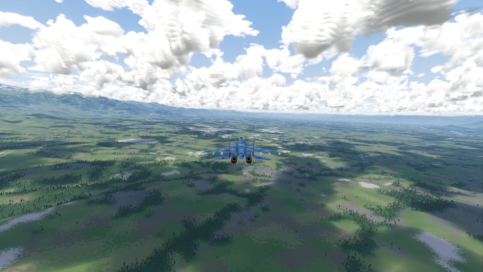 The far chase camera view in FlightOut: a Su-27 seen from further back over the Kashmir valley